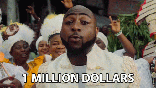 A Man Blowing A Kiss With The Words 1 Million Dollars Above Him GIF