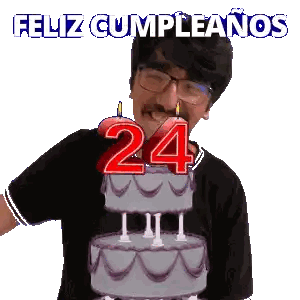 a man blowing out candles on a birthday cake with the number 24