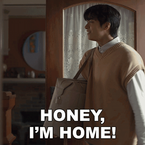 A Man Carrying A Bag With The Words Honey I 'M Home GIF