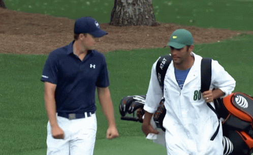 A Man Carrying A Golf Bag Has The Number 80 On His Shirt GIF