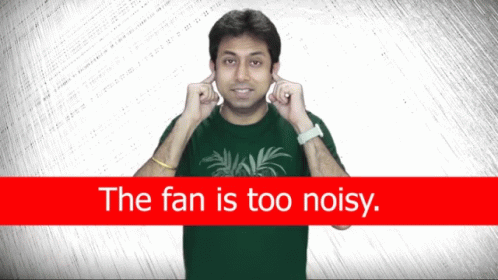 A Man Covering His Ears In Front Of A Red Sign That Says The Fan Is Too Noisy GIF
