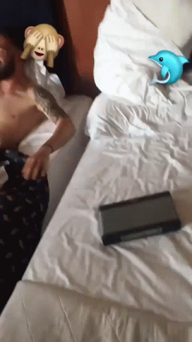 A Man Covering His Eyes With A Monkey Emoji And A Blue Dolphin Emoji GIF