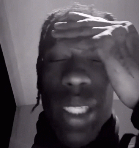 A Man Covering His Face With His Hands And Smiling GIF