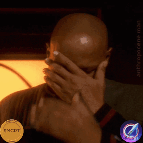 A Man Covering His Face With His Hands Next To A Coin That Says $ Mort GIF