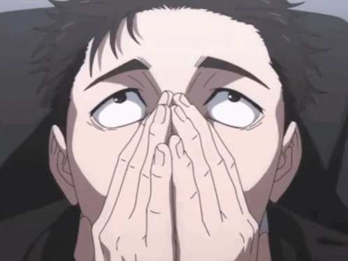 a man covering his face with his hands while looking up