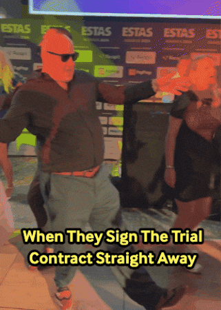 A Man Dancing In Front Of A Sign That Says " Estas " GIF