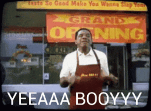 A Man Dancing In Front Of A Sign That Says Grand Opening GIF