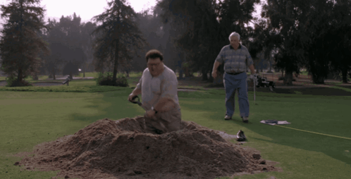 A Man Digging A Hole On A Golf Course With The Words Qu'est Ce Que Vous Faites GIF