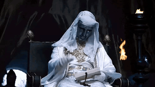 Man Dressed As Nun Reading Book GIF