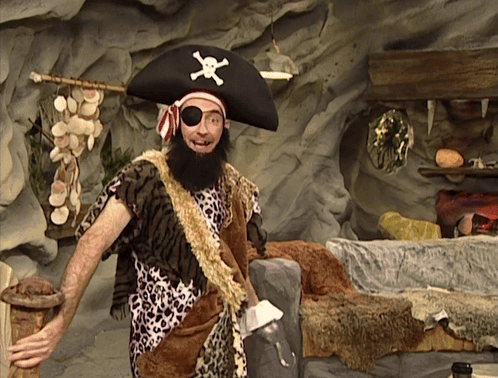 A Man Dressed As A Pirate With An Eye Patch GIF