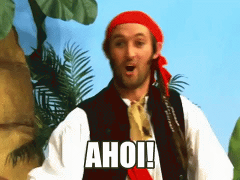 A Man Dressed As A Pirate With The Word Ahoi On His Chest GIF