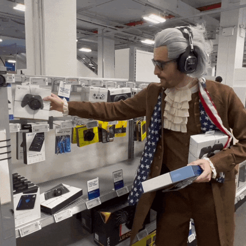 A Man Dressed As Abraham Lincoln Is Holding A Box Of Xbox One GIF