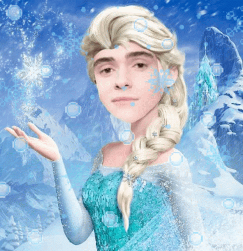 A Man Dressed As Elsa From Frozen With Snowflakes On His Face GIF