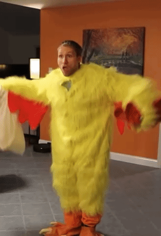 A Man Dressed In A Yellow Chicken Costume GIF