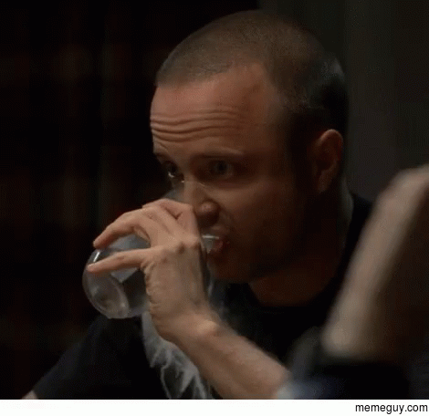A Man Drinking A Glass Of Water With A Memeguy.com Watermark On The Bottom GIF
