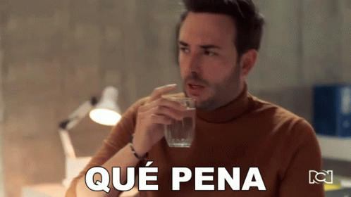 A Man Drinking A Glass Of Water With Que Pena Written On The Bottom Of The Image GIF