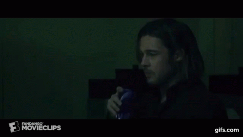 A Man Drinking From A Blue Cup With A Fandango Movie Clips Logo On The Bottom GIF