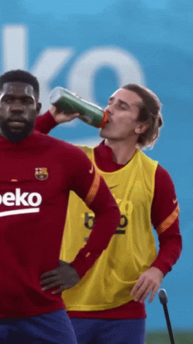 A Man Drinking From A Bottle With The Word Beko On His Shirt GIF
