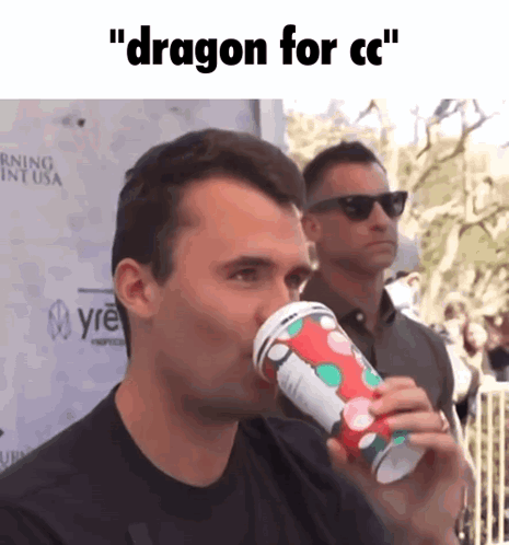 A Man Drinking From A Cup That Says Dragon For Cc On It GIF