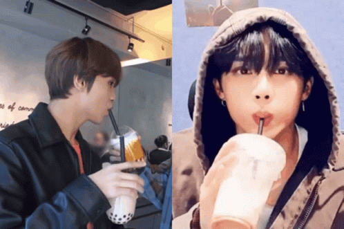 Two Men Drinking From Striped Cups GIF