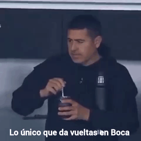 A Man Drinking From A Cup With The Words Lo Unico Que Da Vueltas En Boca Written Below Him GIF