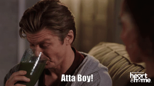 A Man Drinking From A Glass With The Words Atta Boy Written Below Him GIF