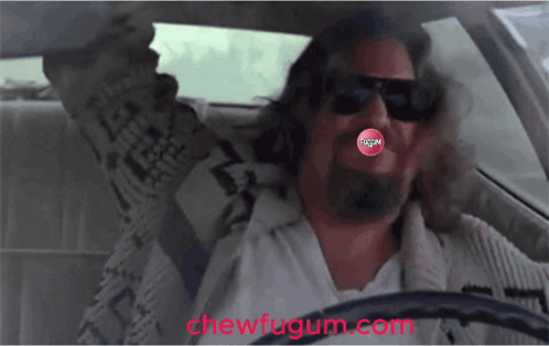 A Man Driving A Car With A Chew Fugum In His Mouth GIF