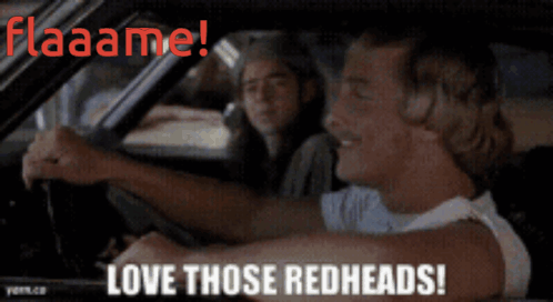 A Man Driving A Car With The Words Flaaame Love Those Redheads On The Bottom GIF