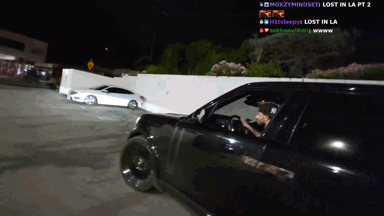 A Man Driving A Car With The Words Lost In La Pt 2 On The Screen GIF