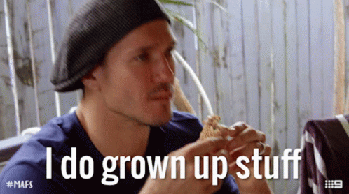 A Man Eating A Sandwich With The Words " I Do Grown Up Stuff " Behind Him GIF