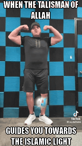 A Man Flexes His Muscles In Front Of A Blue And Black Checkered Wall With The Caption When The Talisman Of Allah GIF