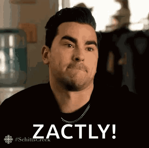 A Man From Schitt 'S Creek Is Making A Face And Says Zachly GIF