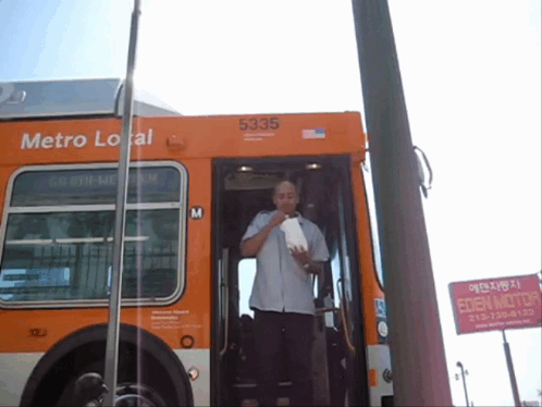 A Man Getting Off A Metro Local Bus With 5335 On The Side GIF