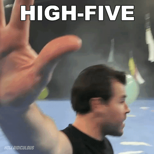 A Man Giving A High Five With His Hand GIF