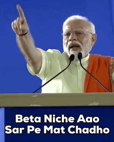 A Man Giving A Speech With The Words Beta Niche Aao Sar Pe Mat Chado Below Him GIF