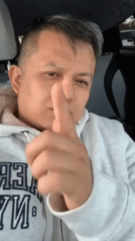 A Man Giving A Thumbs Up In A Car While Wearing A Sweatshirt That Says Abercrombie & Fitch GIF