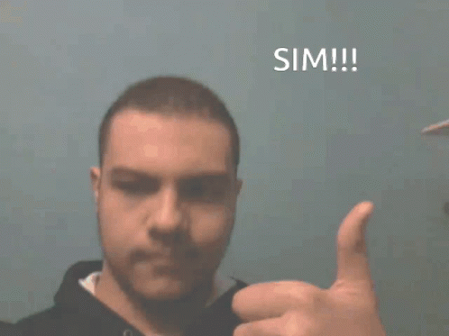 A Man Giving A Thumbs Up In Front Of A Blue Background That Says Sim !!! GIF