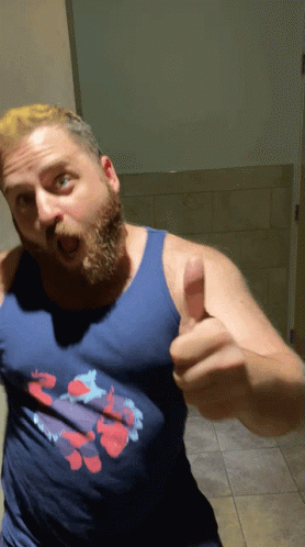 A Man Giving A Thumbs Up Wearing A Blue Tank Top GIF
