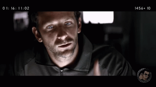 A Man Giving A Thumbs Up With The Time 1457 + 00 At The Bottom GIF