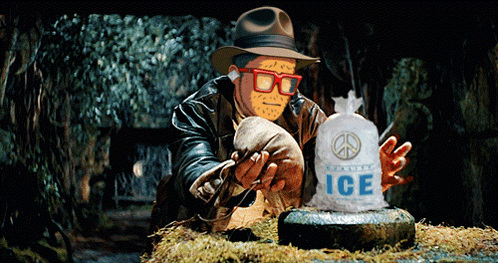 A Man Holding A Bag Of Ice With A Peace Symbol On It GIF