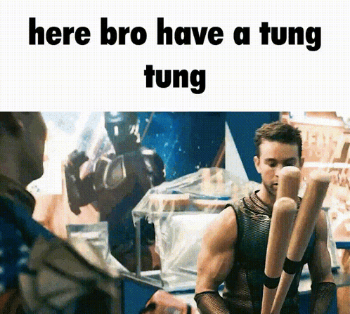 A Man Holding A Bunch Of Baseball Bats With The Words Here Bro Have A Tung Tung GIF