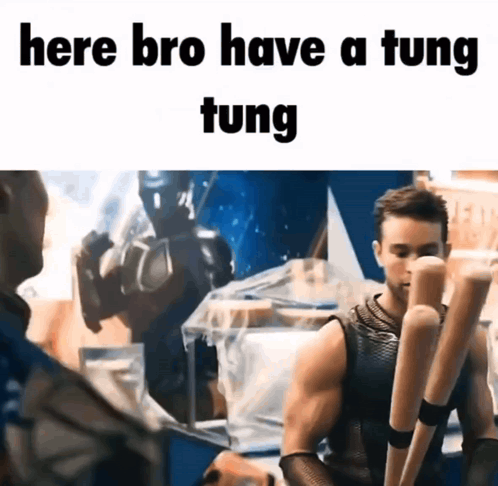 A Man Holding A Bunch Of Baseball Bats With The Words Here Bro Have A Tung Tung GIF