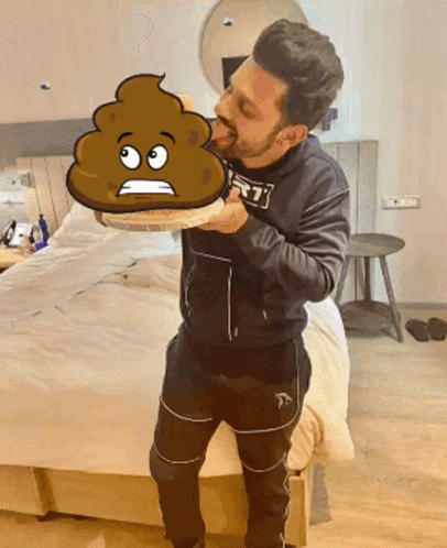 A Man Holding A Cartoon Drawing Of A Poop With A Sad Face GIF