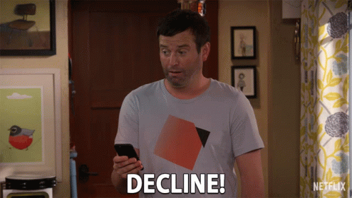 A Man Holding A Cell Phone With The Word Decline On His Shirt GIF