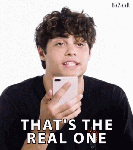 A Man Holding A Cell Phone With The Words That 'S The Real One GIF