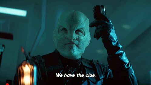 A Man Holding A Cell Phone With The Words We Have The Clue Above Him GIF