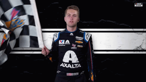 A Man Holding A Checkered Flag Wearing A Shirt That Says Axalta On It GIF