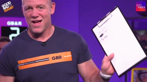A Man Holding A Clipboard With Gbr On His Shirt GIF