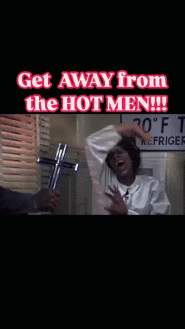 A Man Holding A Cross With The Words Get Away From The Hot Men GIF