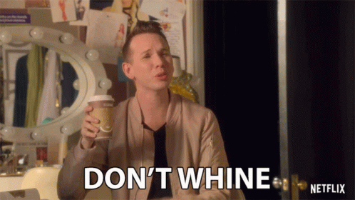 A Man Holding A Cup Of Coffee And Saying " Don 'T Whine " GIF